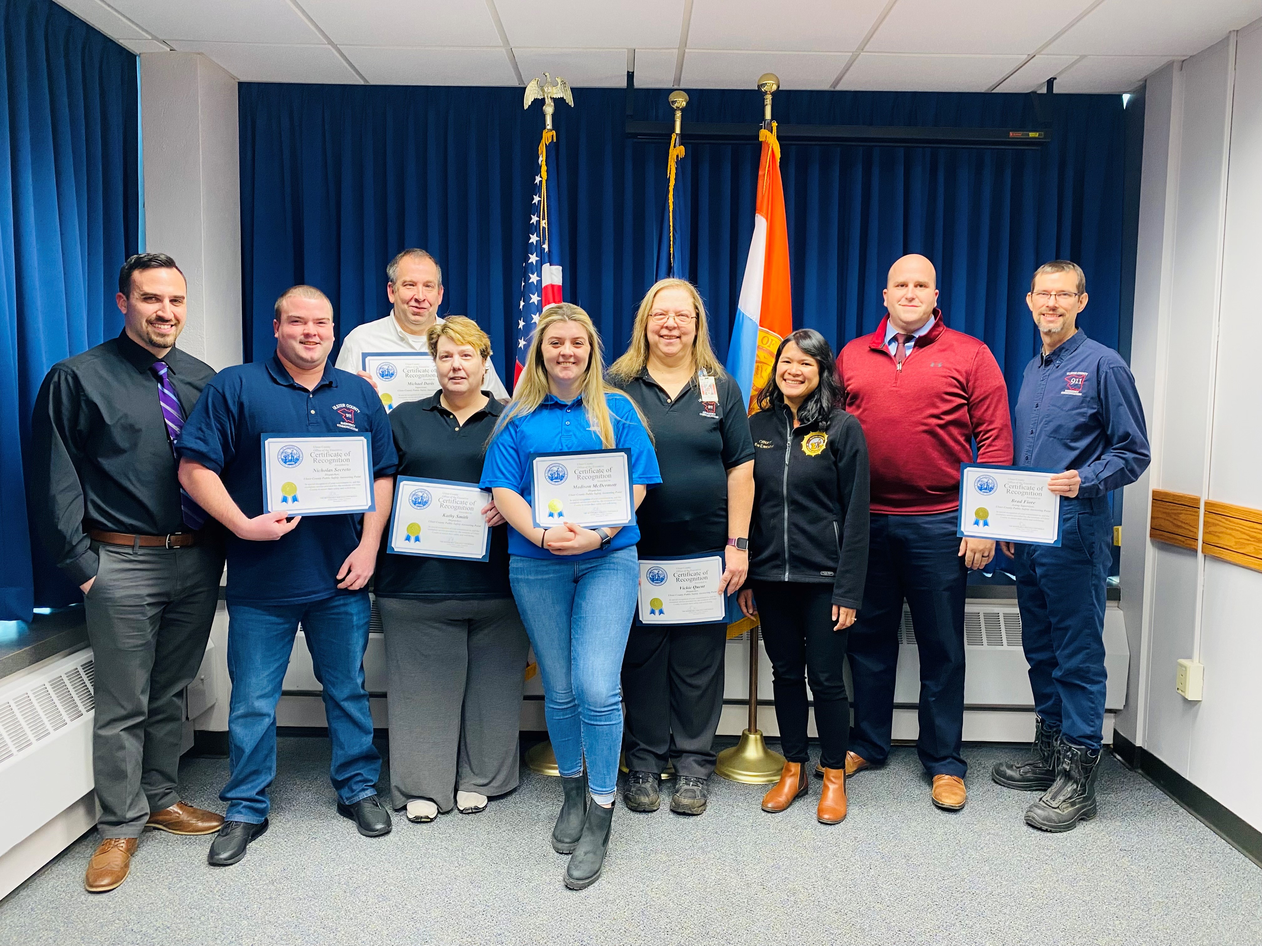 Photo caption (from left to right): Deputy Director of Emergency Communications Andrew Cafaldo, Dispatcher Nicholas Secreto, Supervisor Michael Davis, Dispatcher Kathy Smith, Dispatcher Madison McDermott, Dispatcher Vickie Quent, Acting Ulster County Executive Johanna Contreras, Director of Emergency Services Everett Erichsen and Acting Supervisor Brad Fiore