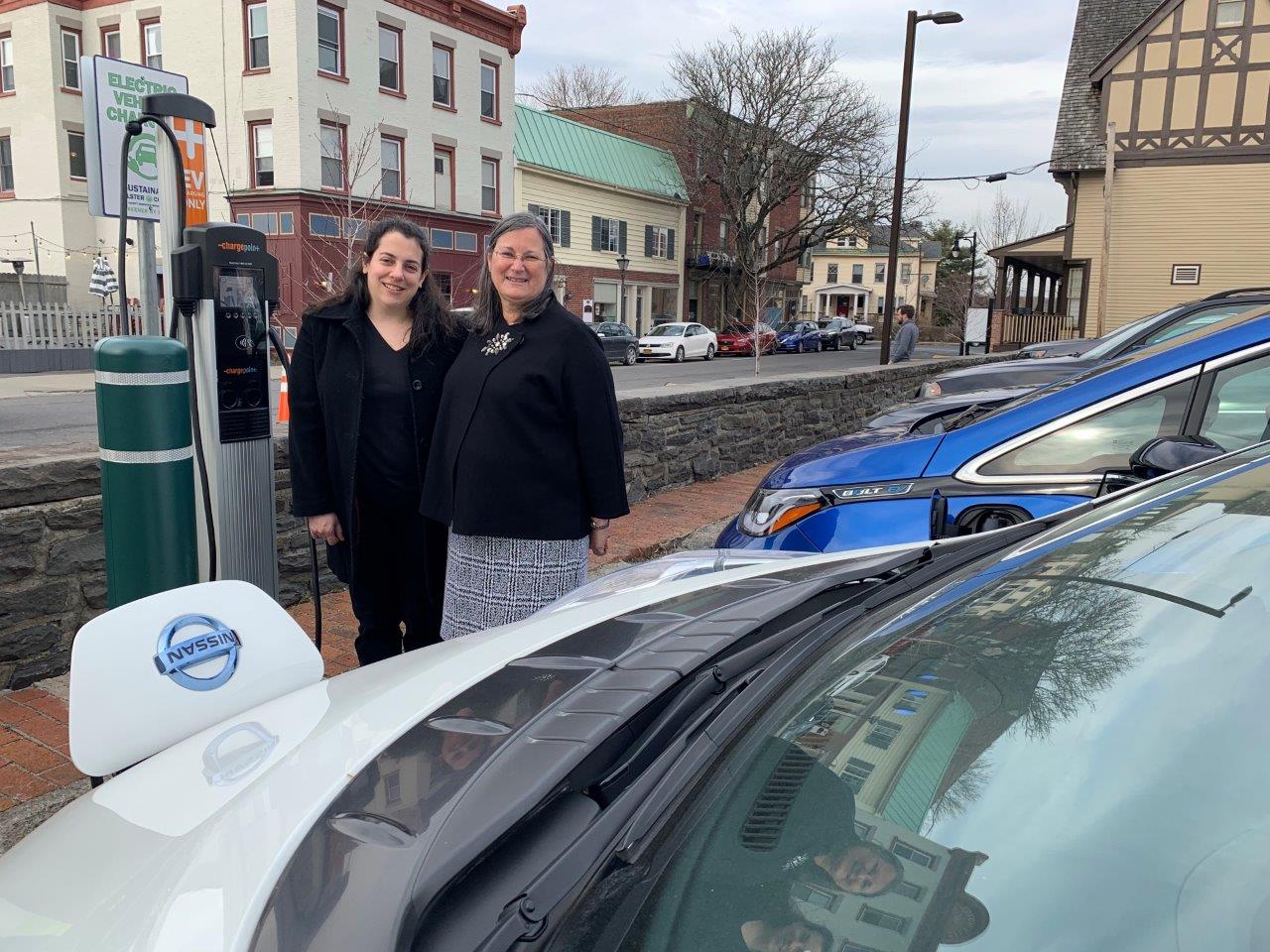 Photo: Acting Ulster County Executive Adele B. Reiter and Amanda LaValle, Director of the Department of the Environment stand beside a battery-electric vehicle, which is part of the County’s growing fleet of 28 electric and hybrid-electric vehicles.