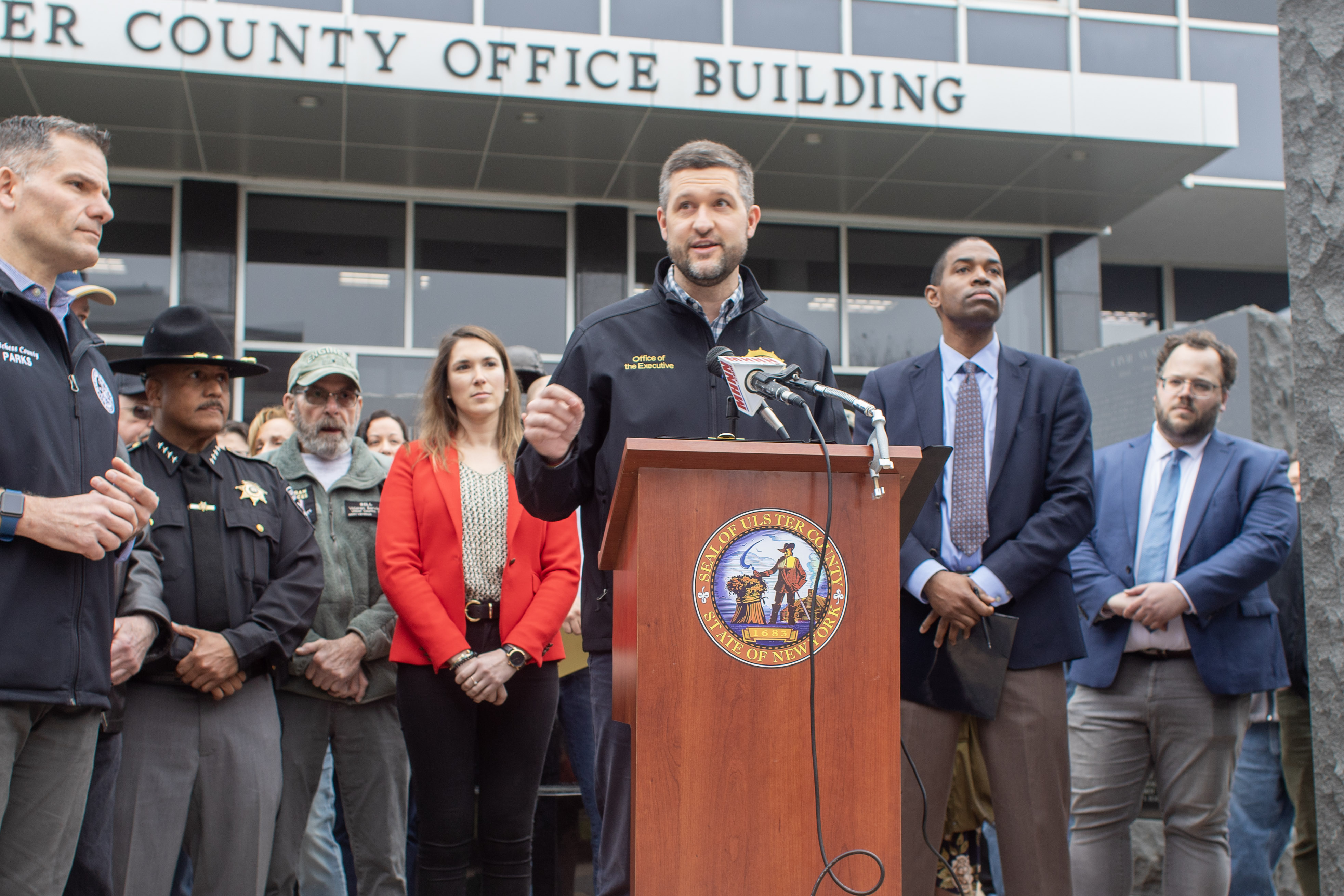 Ulster County Executive Pat Ryan joined by (left to right) Dutchess County Executive Marcus Molinaro, Ulster County Sheriff Juan Figueroa, Senator Michelle Hinchey, Congressman Antonio Delgado, and veterans and veterans advocates